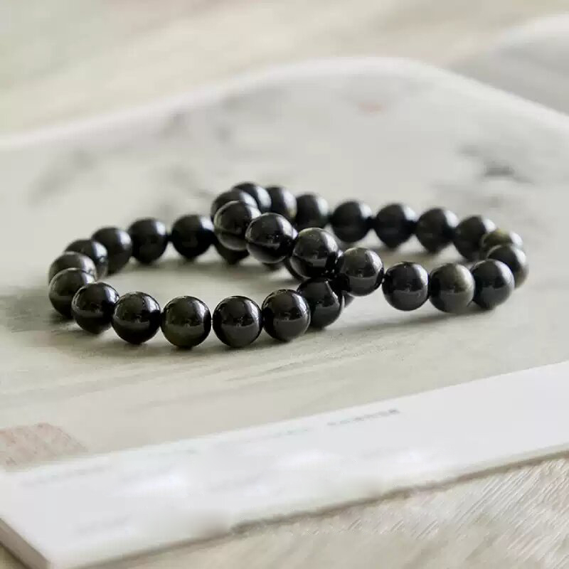 Two Obsidian Calm Charm Bracelets stacked together