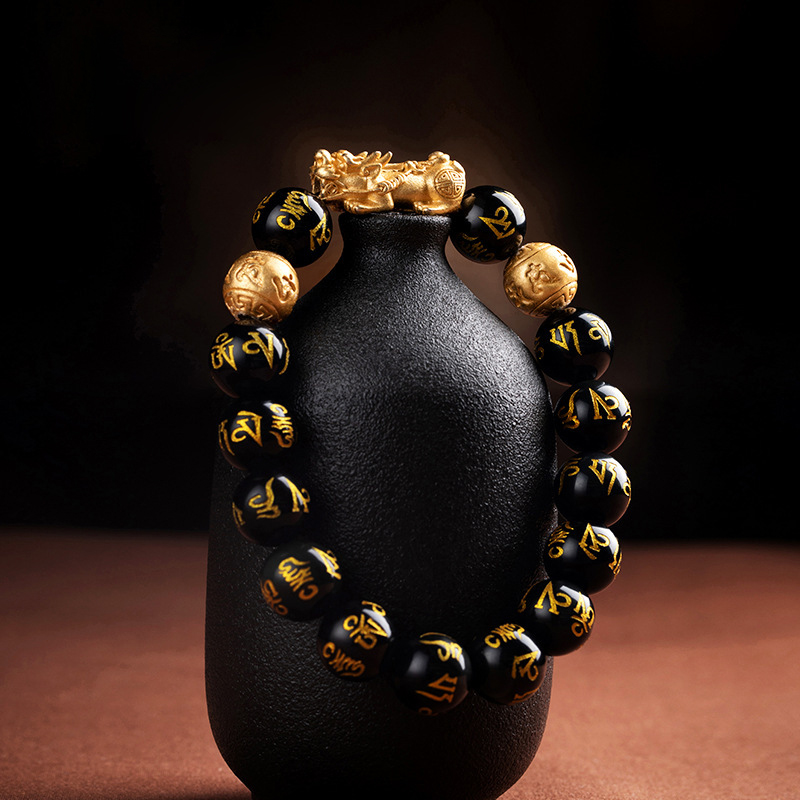 Bracelet hanging on a ceramic teapot