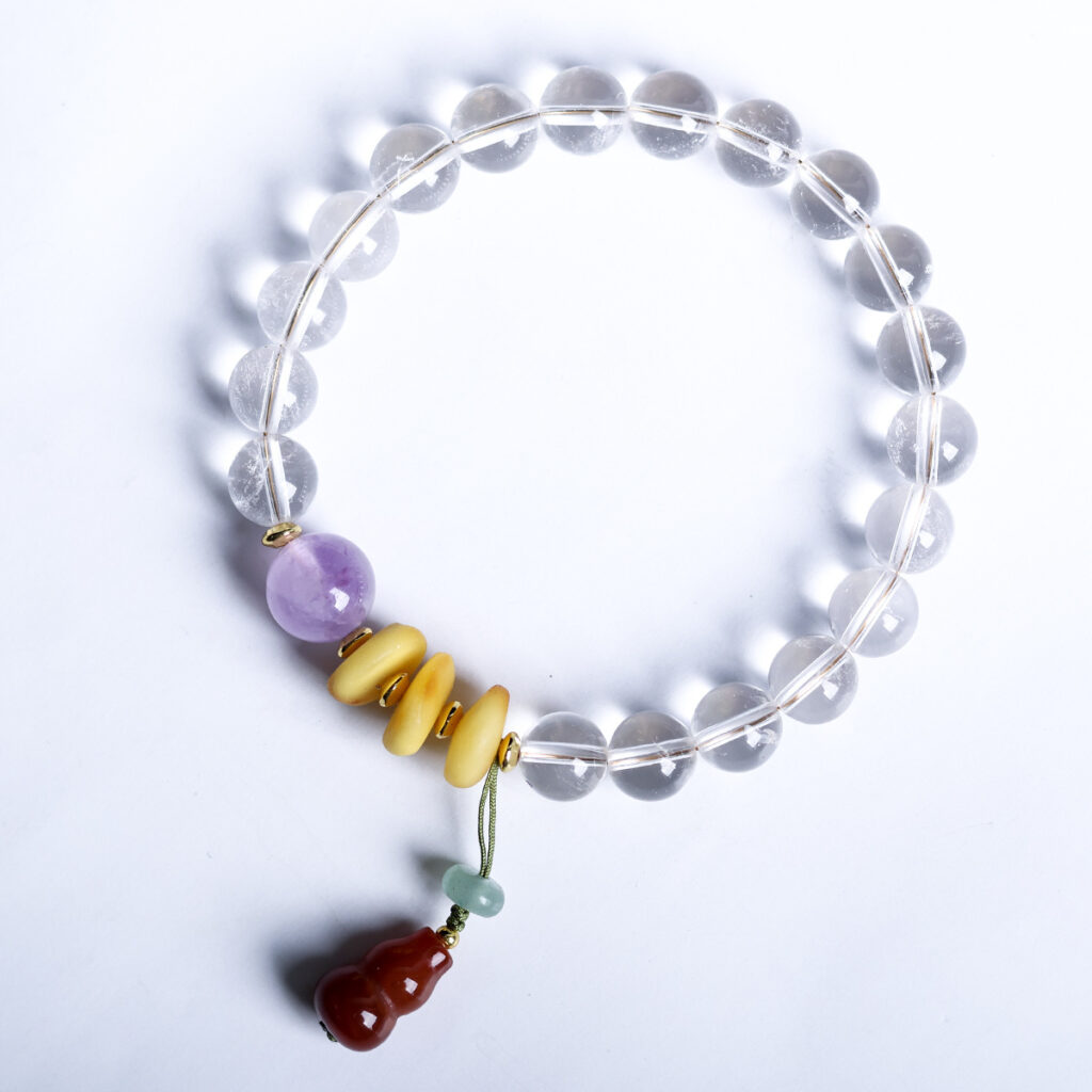 Amethyst and quartz bracelet on a clean white background