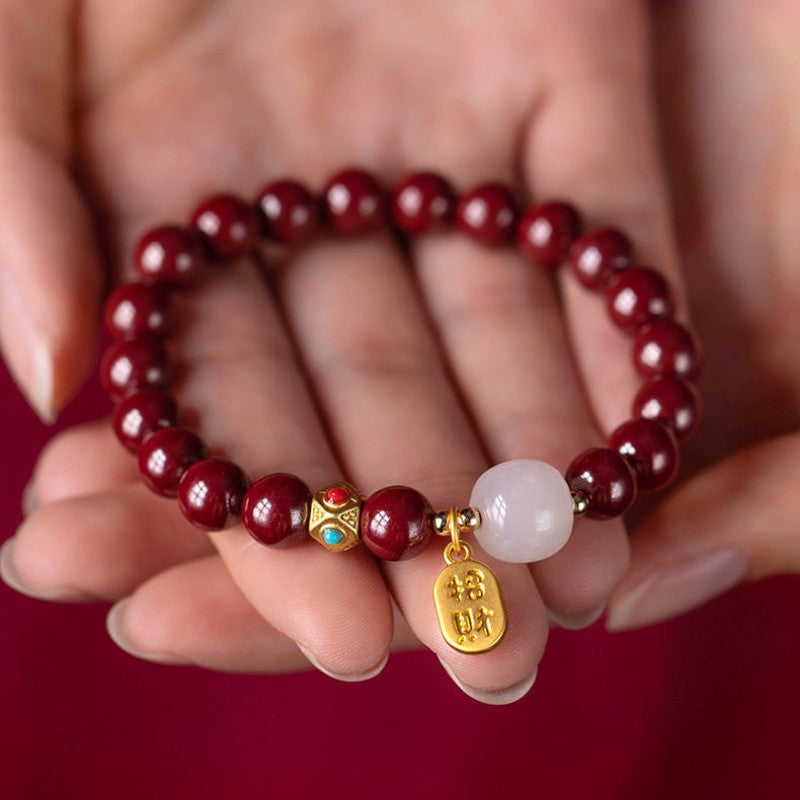 Cinnabar Empowerment Bracelet cupped in hands