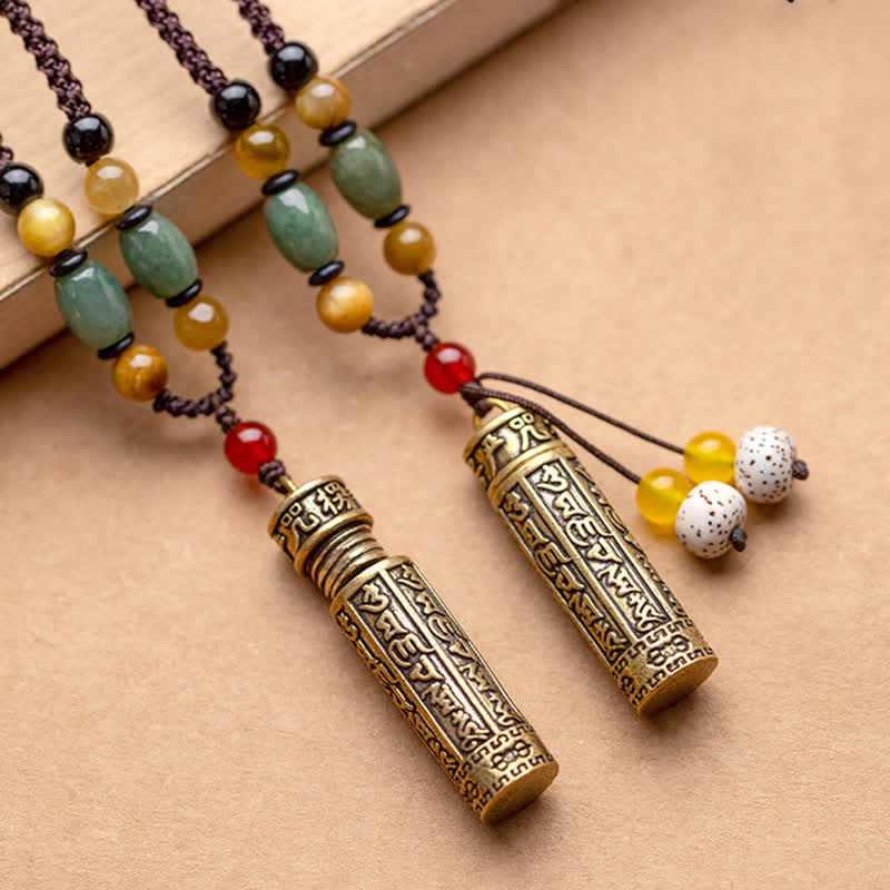 Two Gau box necklaces with and without Bodhi tassel placed side by side