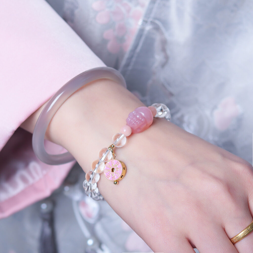 Model wearing the pixiu bracelet showcasing the charms