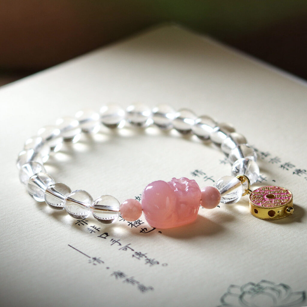 Bracelet displayed on an ancient Chinese calligraphy book