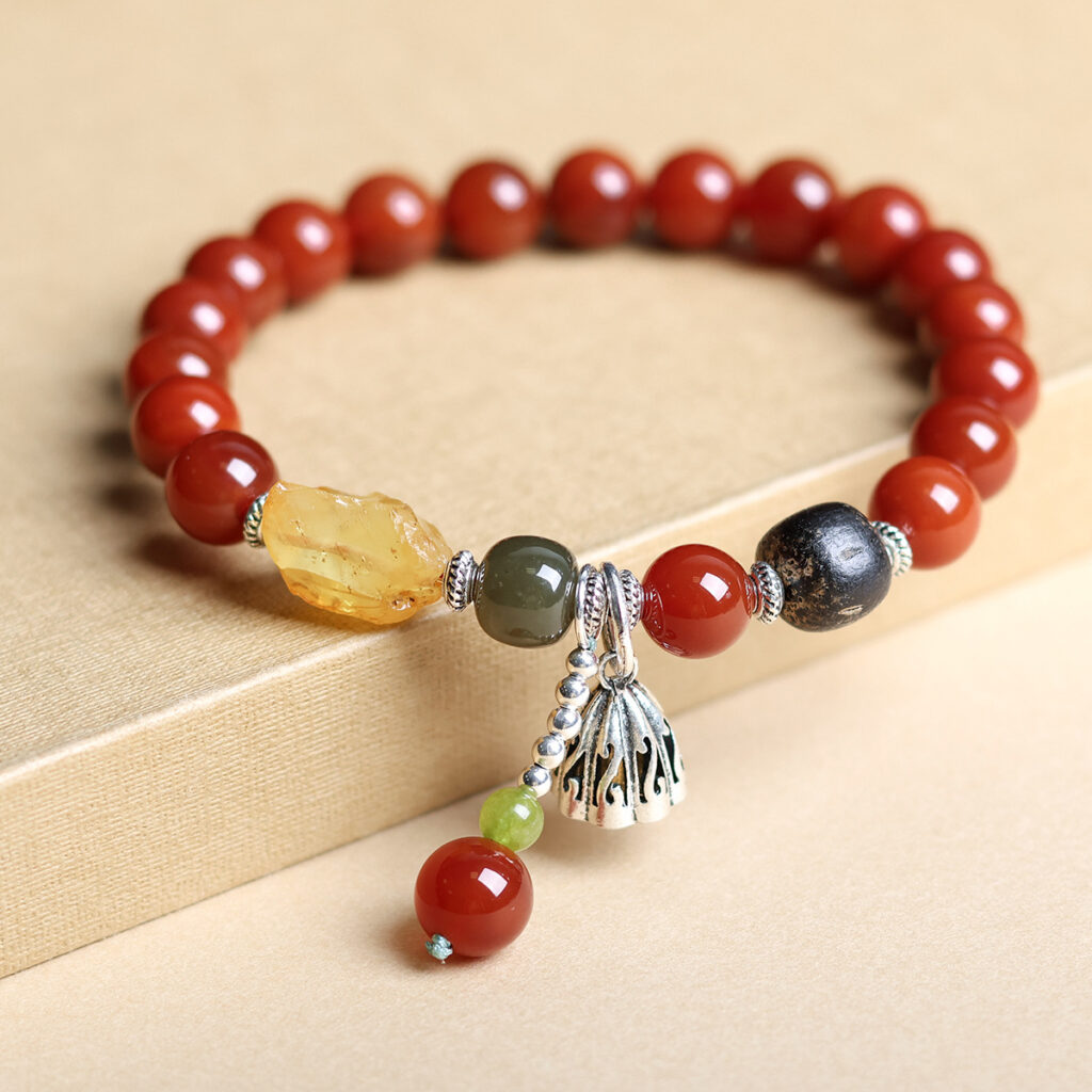 Beeswax amber bracelet placed on the edge of a wooden table, capturing a natural and rustic vibe