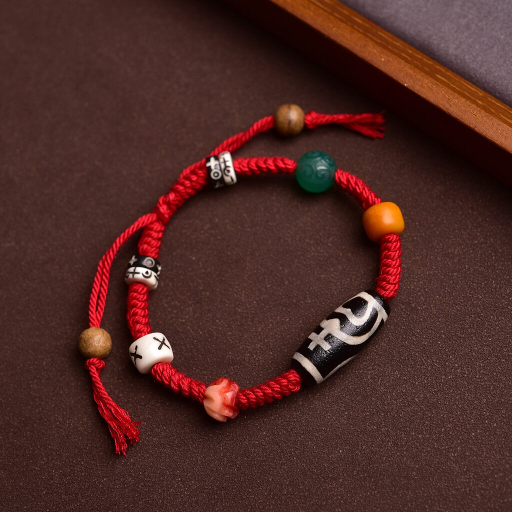 Top view of bracelet with the tibetan dzi beads featuring dzi beads and malachite