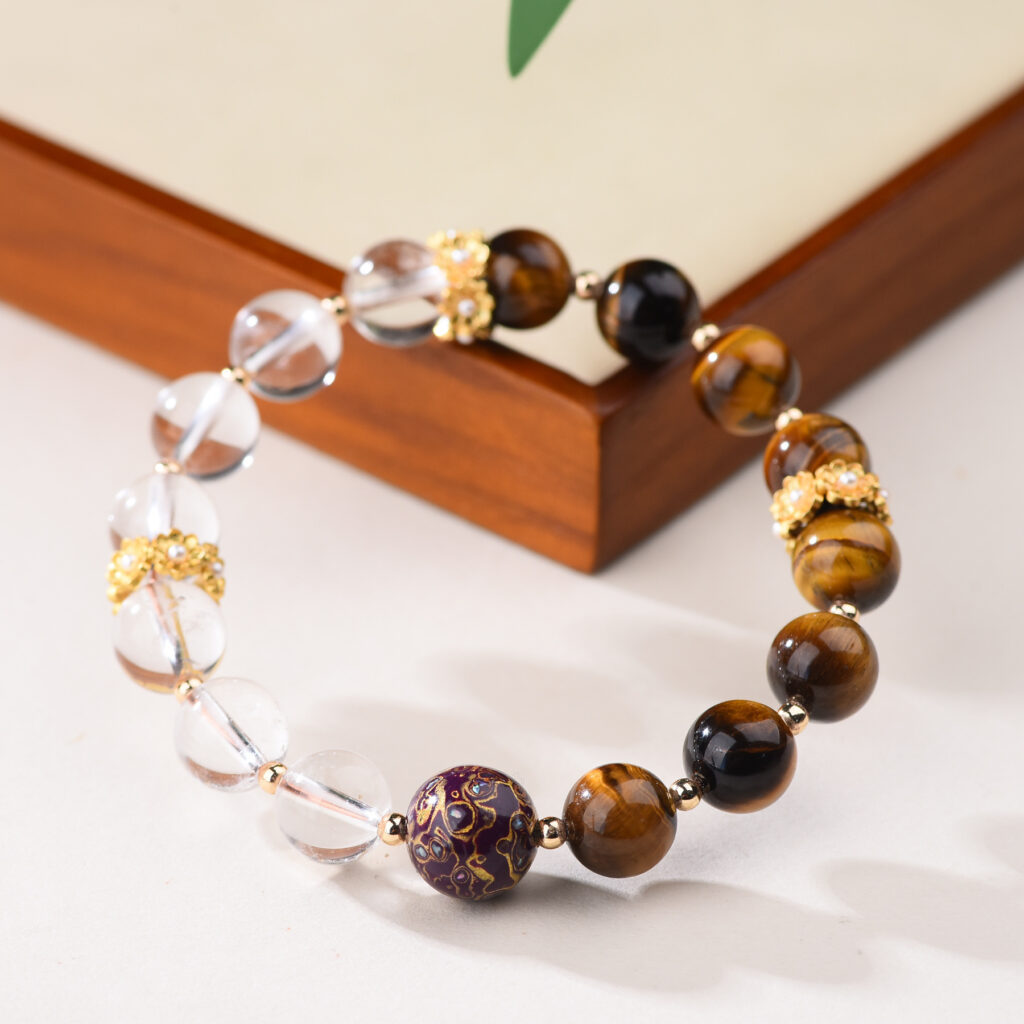 Bracelet displayed on corner of jewelry tray, split design visible
