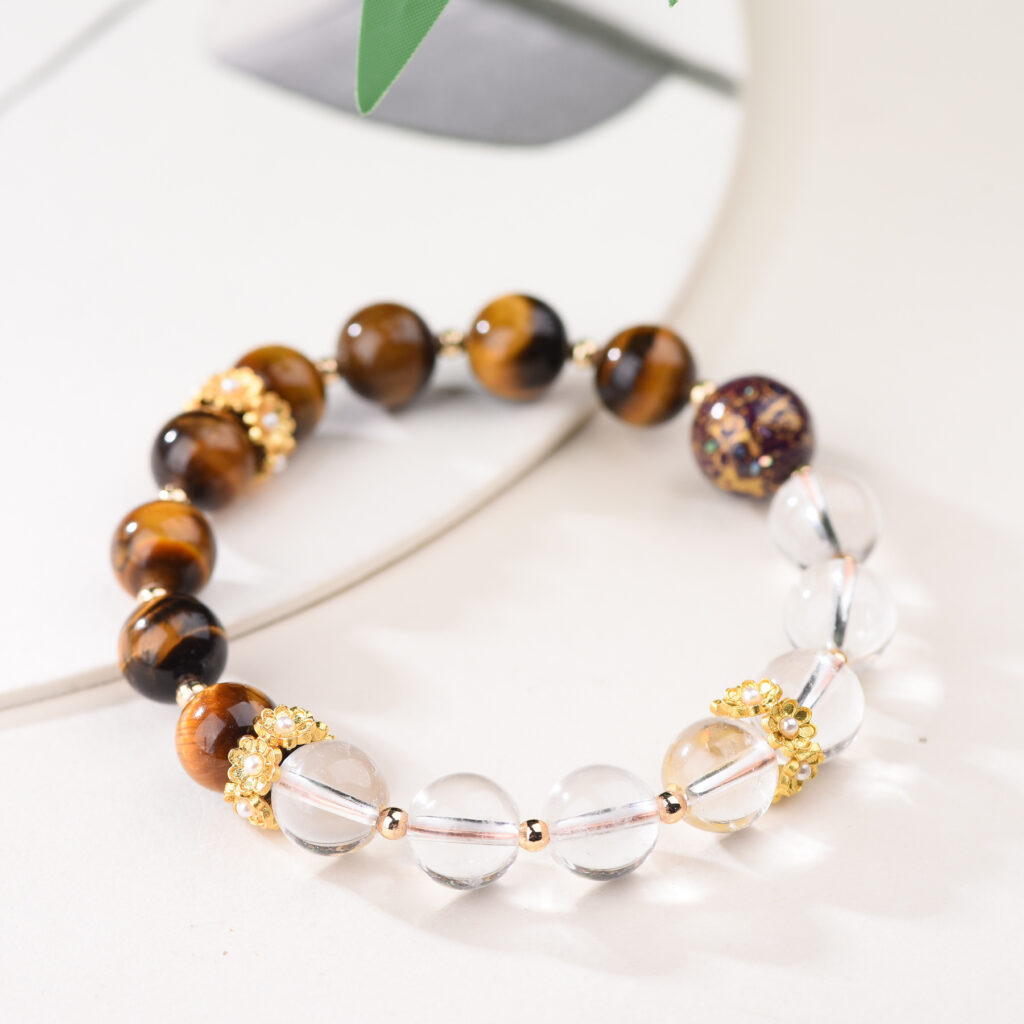Bracelet draped over edge of ceramic dish